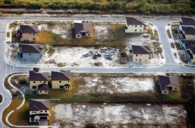 As new home sales and housing starts hit record lows, empty lots, partially constructed homes and abandoned ones are seen in a subdivision on January 30, 2009 near Homestead, Florida. Prices in November of 2008 declined 8.7 percent from a year earlier, the biggest drop in records going back to 1991, the Federal Housing Finance Agency reported. (Joe Raedle/Getty Images)