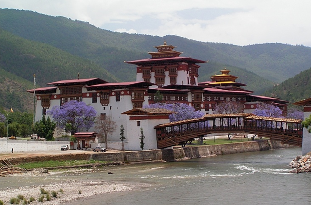 Dzong, bridge and blossoming jacarandas by Deepforest. Punakha is the administrative center of Punakha dzongkhag, one of the 20 districts of Bhutan. Punakha was the capital of Bhutan and the seat of government until 1955, when the capital was moved to Thimphu. It is about 72 km away from Thimphu and it takes about 3 hours by car from the capital Thimphu.