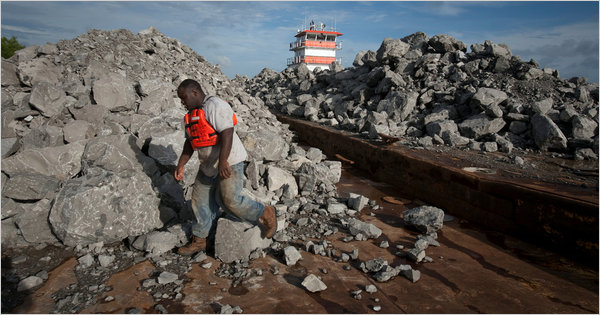 Tons of rocks intended for a protective barrier against the oil spill are on Mississippi River barges in Pointe &agrave; la Hache, Louisiana. Lee Celano for The New York Times