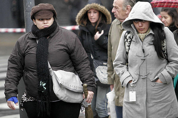 People bundle up on the streets of Buenos Aires Monday as record cold temperatures hit several South American nations, 19 July 2010. Newscom / File via csmonitor.com