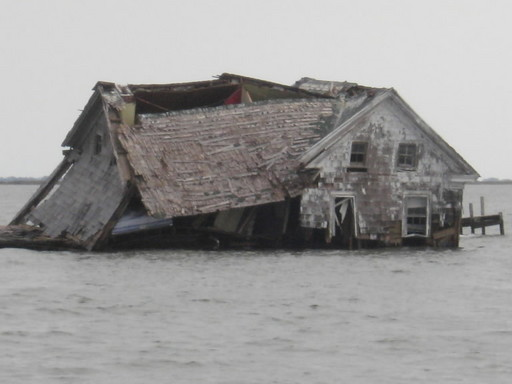 A storm in October 2010 dealt a crippling blow to the last building on Holland Island in Chesapeake Bay, a remnant of a once-thriving town. Rising sea level has claimed the island.  Photo: Shawn Ridgley, Chesapeake Bay Foundation