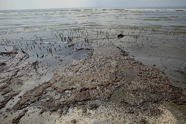 Gulf oil spill: Oil from the Deepwater Horizon spill invades the beach, Monday, in Port Fourchon, La. Charlie Neibergall / AP
