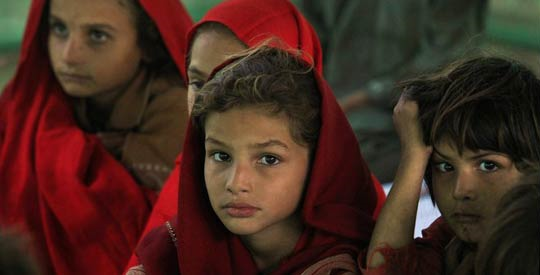 Child refugees of the 2010 Pakistan flood. 'The coming cold months will sharply increase the numbers of respiratory infections and malnutrition, two of the biggest killers of Pakistani children,' said Daniel Toole, UNICEF’s Regional Director for South Asia. Reuters
