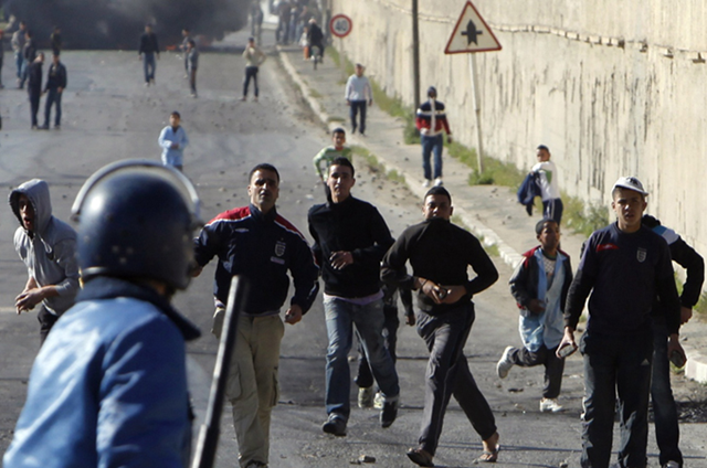 Hundreds of youths clashed with police in several cities in Algeria over food price rises and unemployment. REUTERS