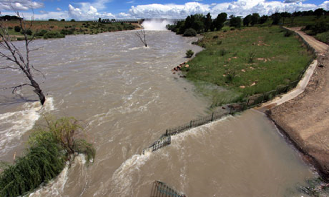 The Vaal dam overflows near Johannesburg, January 2011. Seven of South Africa's nine provinces have been affected by flooding. Jon Hrusa / EPA