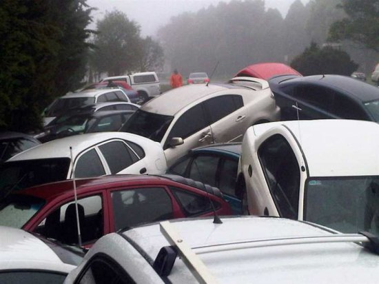 Cars are piled up after flash flood waters rushed through Toowoomba, Australia, 10 January 2011. Massive amounts of infrastructure have been destroyed by the flash floods in Toowoomba that killed eight people, the Queensland city's mayor said. EPA / KEIRA LAPPIN