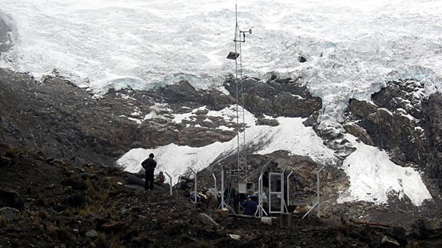 An undated photo released by ANDINA in 2010 shows technicians on the Huaytapallana snowcap, which has shed half of its surface ice in just 23 years, officials said Wednesday, 24 February 2011. AFP