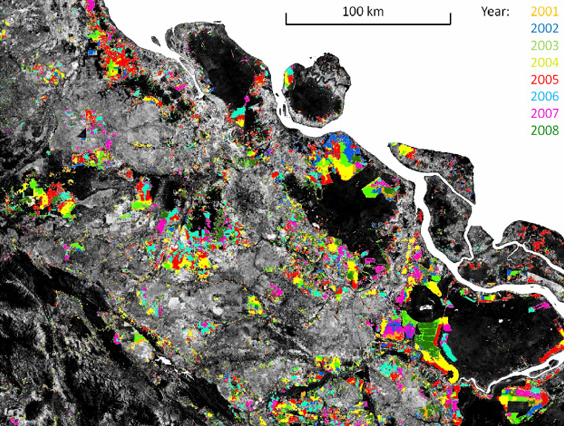 Temporal disaggregation of the moderate spatial resolution forest cover loss map for Riau province, Sumatera. Landsat band 5 is displayed in grayscale with dark tones representing forest cover. Colors mark the year of MODIS-detected forest cover loss. Image and caption courtesy of Broich 2011 / mongabay.com