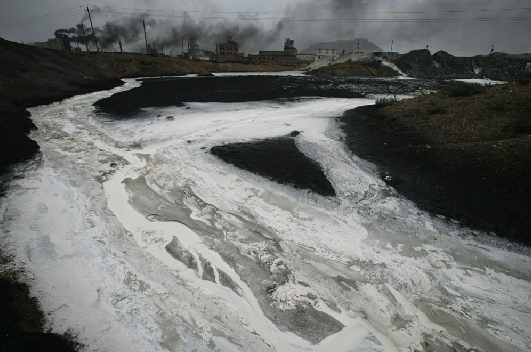 Industrial waste flows into the Yellow River from the Lasengmiao Industrial District in Inner Mongolia, 26 July 2005. Lu Guang