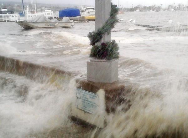 Water surges over the seawall on Balboa Island in December 2010, when a major storm hit during an extremely high tide. Newport Beach city workers had to pump the water back into the harbor. Newport Beach General Services / dailypilot.com