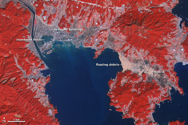 NASA&rsquo;s Terra satellite observed dramatic changes at Rikuzentakata on March 14, 2011. Water is blue; buildings and paved surfaces appear blue-gray. Agricultural fields range in color from brown to beige to pink. Vegetation is red, and brighter shades indicate more robust vegetation. In the wake of the tsunami, the coastline of Rikuzentakata has been totally reshaped. NASA Earth Observatory image by Robert Simmon and Jesse Allen, using data from the GSFC/METI/ERSDAC/JAROS, and U.S./Japan ASTER Science Team
