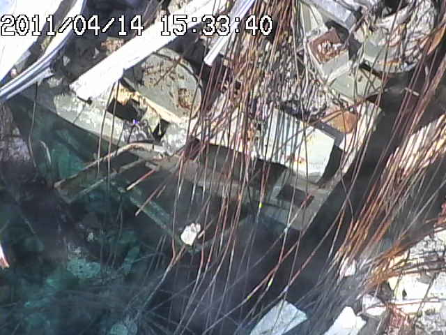 Fukushima spent fuel rod pool Unit 3, taken from concrete pumping vehicle, 14 April 2011. TEPCO / japannewstoday.com