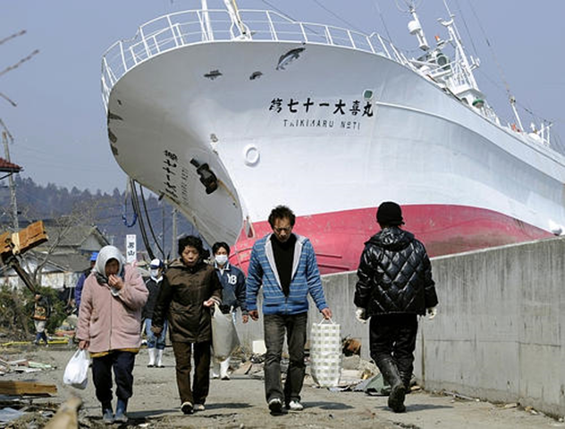 The tsunami washed this fishing boat onto the breakwater of a river in Kesennuma, Miyagi Prefecture. nypost.com
