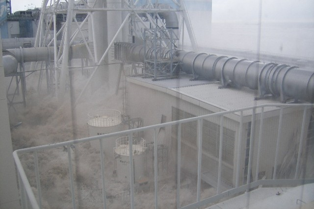 Tsunami wave inundates the Fukushima Daiichi Nuclear Power Station, 11 March 2011. The location is the north side of the Radiation Waste Treatment Facility, taken from 4th floor at approximately 3:43 PM. TEPCO