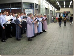 A group of mennonites singing on the subway as part of their witness.