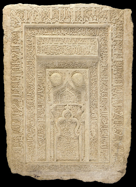 By using a series of different scripts (plaited kufic around the edges, naskh and kufic on the inner bands, and simple kufic just below the arch), carved on different planes, the calligrapher created an extremely rich surface that reverberates with the patterns of the lines. Calligrapher: Ahmad b. Muhammad b. Ahmad Asid. Iran. 1154-1155 A.D. 92.5 x 67.6 cm. Kufic script. Courtesy of the Freer Gallery of Art, Smithsonian Institution.