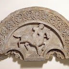 The vegetal decoration surrounding the central figure resembles that found on fourteenth- and fifteenth-century tombstones of the town of Kubachi, presently in the republic of Daghestan in the Caucasus. This attribution is supported by the "cloud" collar that covers the rider's chest, which became fashionable after the arrival of the Mongols in the area and was popular in the fifteenth century. The horseman represents a traditional image of a Central Asian nomadic archer, symbolic of the Mongol roots of the Golden Horde (1227–1502). In the thirteenth and fourteenth centuries, between the Ilkhanid and the Timurid periods, this dynasty ruled over a large area in Russia, including the province of Daghestan on the north shore of the Caspian Sea. The horseman and his mount provide valuable information about costume and trappings in the Caucasus at this time. A short, tight-fitting short-sleeved tunic is worn over another garment. Tight-fitting high boots,a belt, and a hood reaching to the neck complete the costume