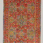This carpet is known as a Star Ushak, from the star shape of its medallions and the weaving center from which it originates. In the use of a primary star-shaped medallion on a field containing a secondary floral scroll, the Anatolians no doubt were influenced by northwest Persian book design, as seen in buildings or illumination, or by Persian medallion carpets. Unlike the Ottoman medallion carpets of Cairo and Bursa, the ground scroll here is secondary to the medallion scheme. The blue medallions on the red ground are the traditional colors of these carpets. Star Ushaks, extremely popular in the West and copied there, are portrayed in European paintings as early as the second quarter of the sixteenth century.