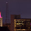 Electric Tower in Downtown Buffalo lit up in pink, and the old Buffalo Savings Bank gold-dome.
