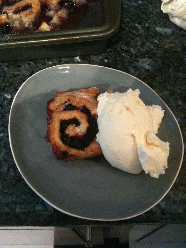 Plated blackberry cobbler with vanilla ice cream