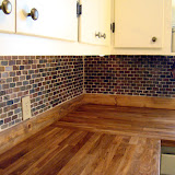 This is one of my favorite shots of the kitchen. You can see the butcher block counter tops, the backsplash, the refinished cabinets, and the new hardware.
