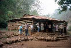 The old schoolhouse with several of the villagers