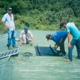 Installing the solar panel on the roof of the school