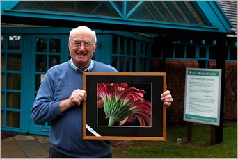 Don Bennett with exhibition picture, Gerbera, by Tom Heslop