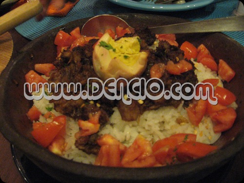 Adobo Flakes cooked over rice served with red egg and diced tomatoes...