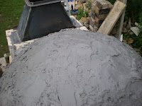 Closed dome covered in mortar from above looking forward.