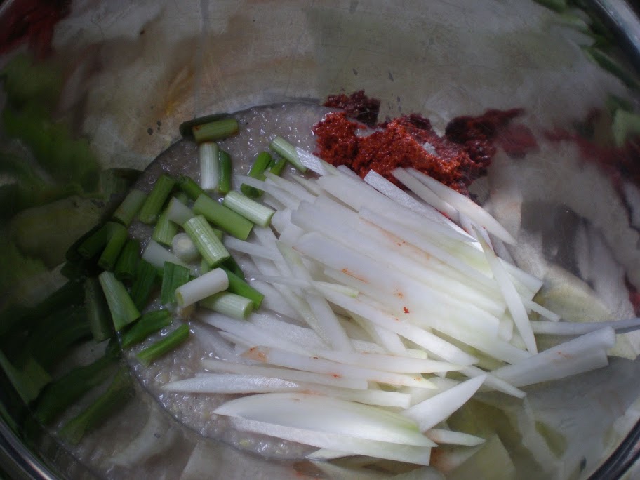 Pastes, radish and scallions go into a bowl