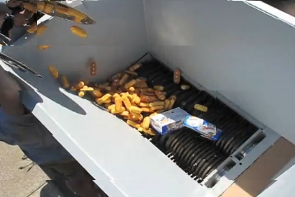 Yes, they ARE feeding Twinkies to a shredding machine. image of Twinkies being fed to an industrial-strength shredder