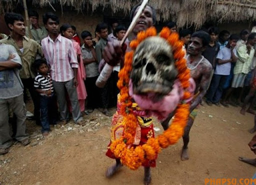 Hindu devotees dance with human remains during Shiva-Gajan festival in Kurmun, a remote village about 165 kilometers (102 miles) west of Calcutta, India, Tuesday, April 13, 2010. Shiva-Gajan is a traditional festival performed on the last day of Bengali calendar year when members of the community exhume body parts from graveyards and carry them in a procession to appease Hindu Lord Shiva. (AP Photo)
