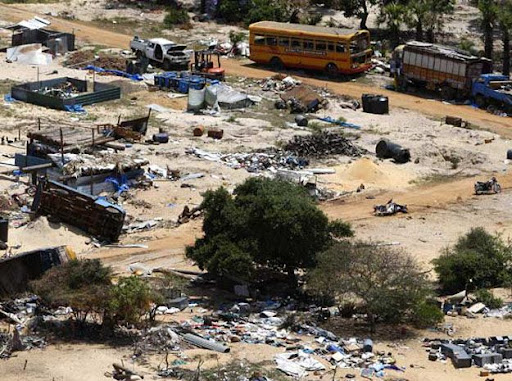 The abandoned devastation is seen in this aerial photo showing part of the former conflict zone on the north east coast on the Jaffna peninsula of Sri Lanka, Saturday, May 23, 2009. Many thousands of Tamil people were displaced over the final months of fighting, leaving some areas largely deserted, with displaced people being housed in tented camps. (AP Photo/Kirsty Wigglesworth)