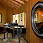 A photo of the den with a Steinway baby grand piano.