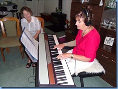 Delyse Whorwood trying out the Korg SP250 digital piano with Jean Watt watching on attentively