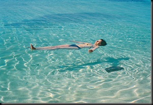 cuba-trinidad-caribbean-sea-playa-ancon-woman-floating-on-clear-water-shadow-1-my