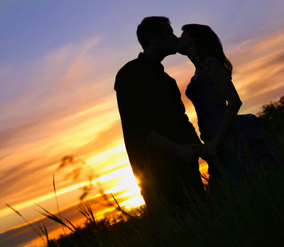 couple kissing sunset. Silhouette Of A Couple Kissing
