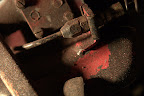 Front brake hose connector and filthy suspension parts.