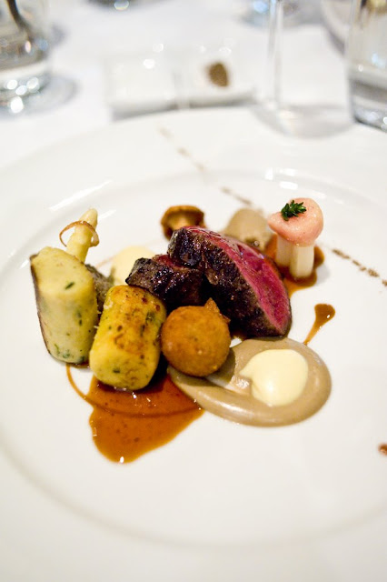 Seared loin of Cervena venison with bone marrow gnocchi, white asparagus and Café de Paris croquette