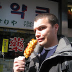 Koreans love when you take a picture in the middle of a busy market with an awkward face while holding a corn dog.