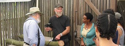 Ken demonstrates drilling an oak log to inoculate mushroom dowels Ken demonstrates drilling an oak log to inoculate mushroom dowels