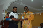 UMIC's Murugesan presents souvenir to Subramaniar Alayam temple chairman