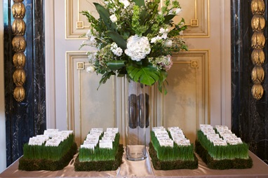 escort card bed of wheat grass floral arrangement sweetchic events