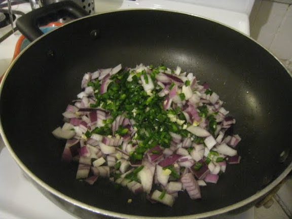 Saute onion, garlic, and hot green chili pepper