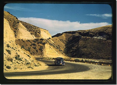 Road cut into the barren hills which lead into Emmett. Emmett, Idaho, July 1941. Reproduction from color slide. Photo by Russell Lee. Prints and Photographs Division, Library of Congress