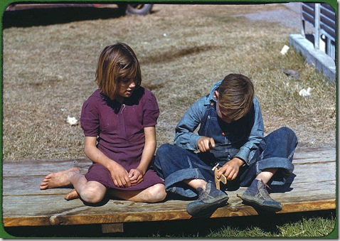 Boy building a model airplane as girl watches. Robstown, Texas, January 1942. Reproduction from color slide. Photo by Arthur Rothstein. Prints and Photographs Division, Library of Congress