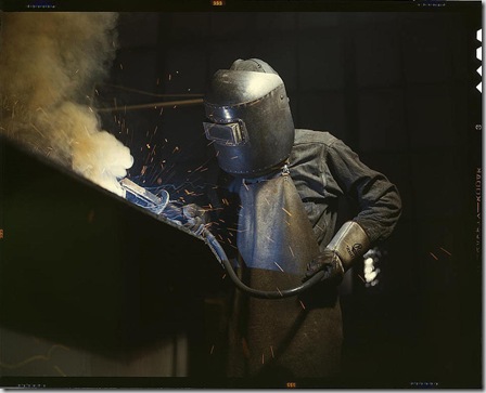 Welder making boilers for a ship, Combustion Engineering Company. Chattanooga, Tennessee, June 1942. Reproduction from color slide. Photo by Alfred T. Palmer. Prints and Photographs Division, Library of Congress