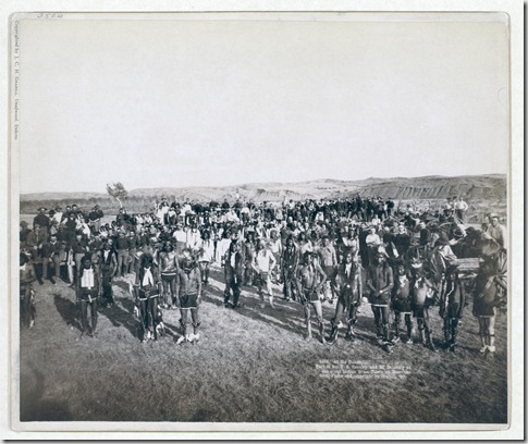 Title: At the Dance. Part of the 8th U.S. Cavalry and 3rd Infantry at the great Indian Grass Dance on Reservation
Group portrait of Big Foot's (Miniconjou) band and federal military men, in an open field, at a Grass Dance on the Cheyenne River, S.D.--on or near Cheyenne River Indian Reservation. 1890.
Repository: Library of Congress Prints and Photographs Division Washington, D.C. 20540