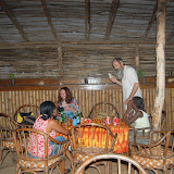  &ndash; Another dinner at Ramada's. Fr. Seraphim listens to the ocean in a shell.…. © 2008 NHA Photos, James Mansaray: Photographer